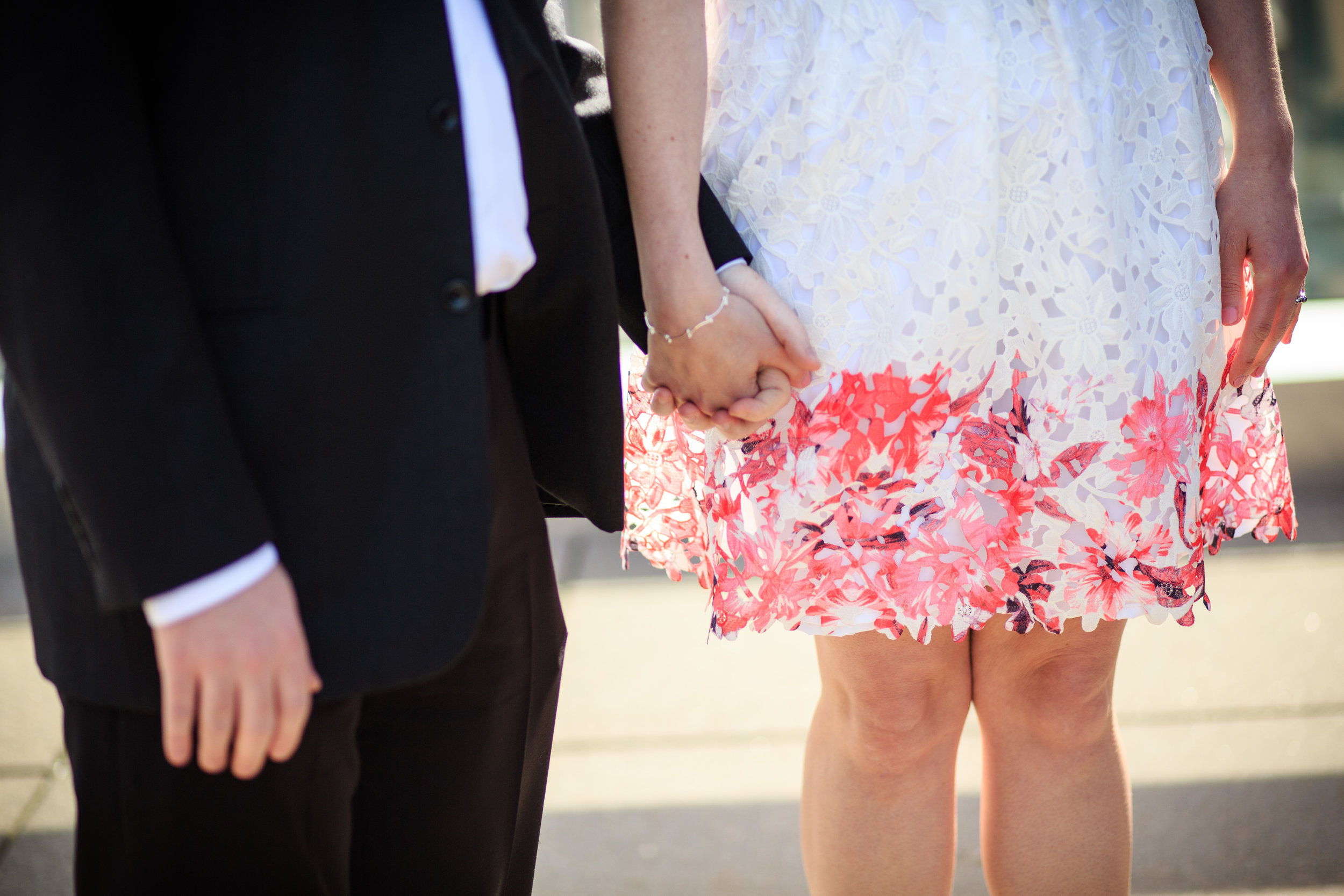 Couple holding hands at courthouse wedding