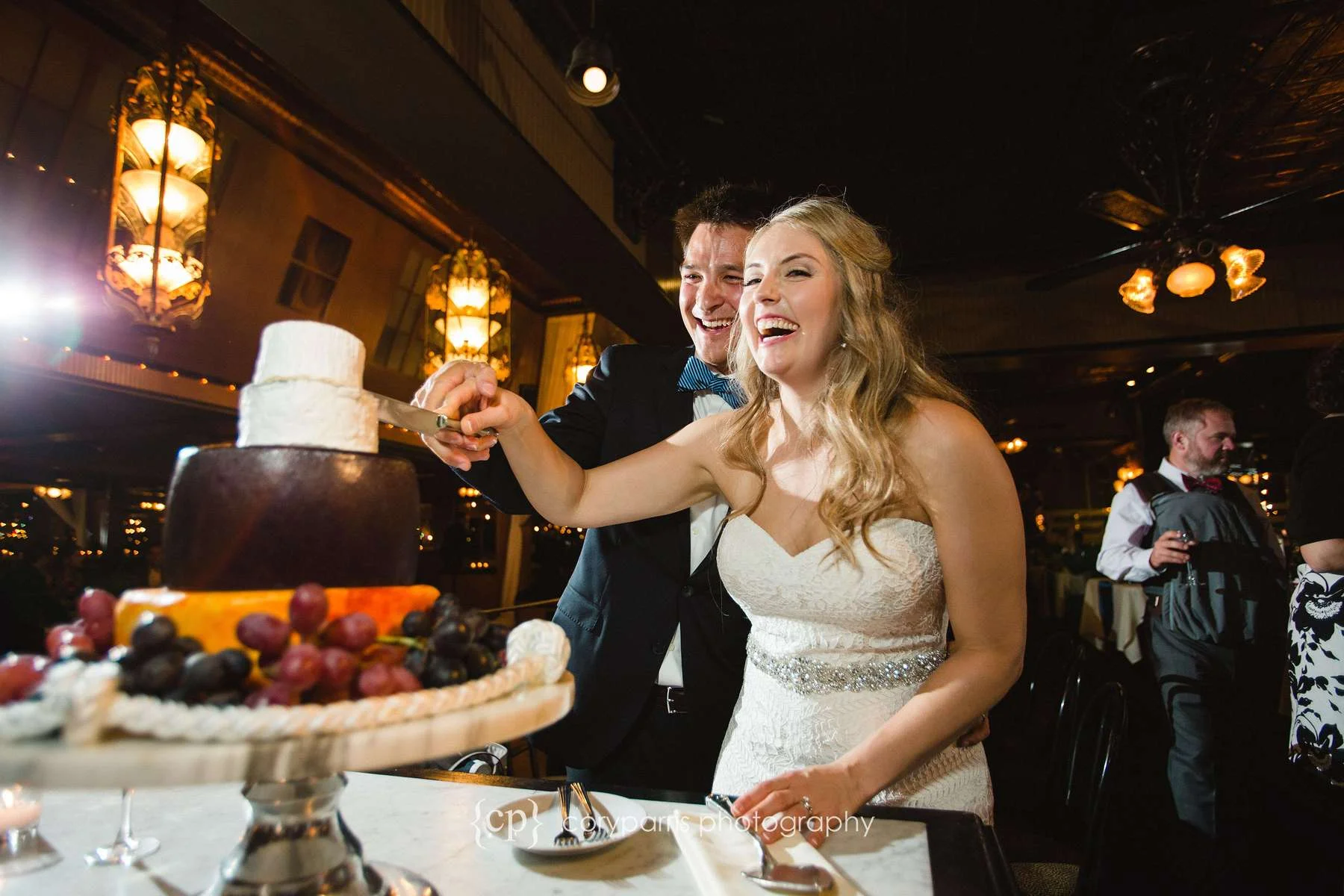 Cutting cake at Lake Union Cafe wedding