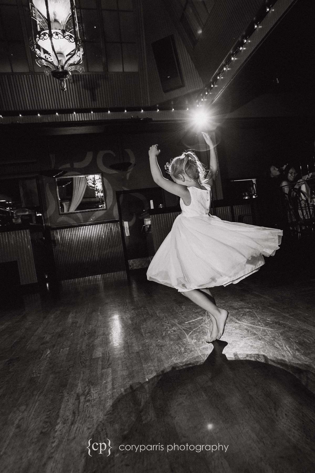 Little girl dancing at Lake Union Cafe wedding
