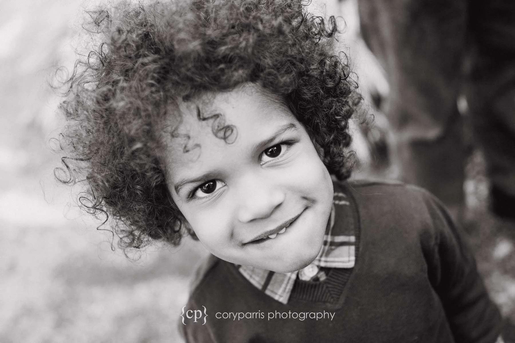 cute little boy with bushy hair b&w portrait photographer