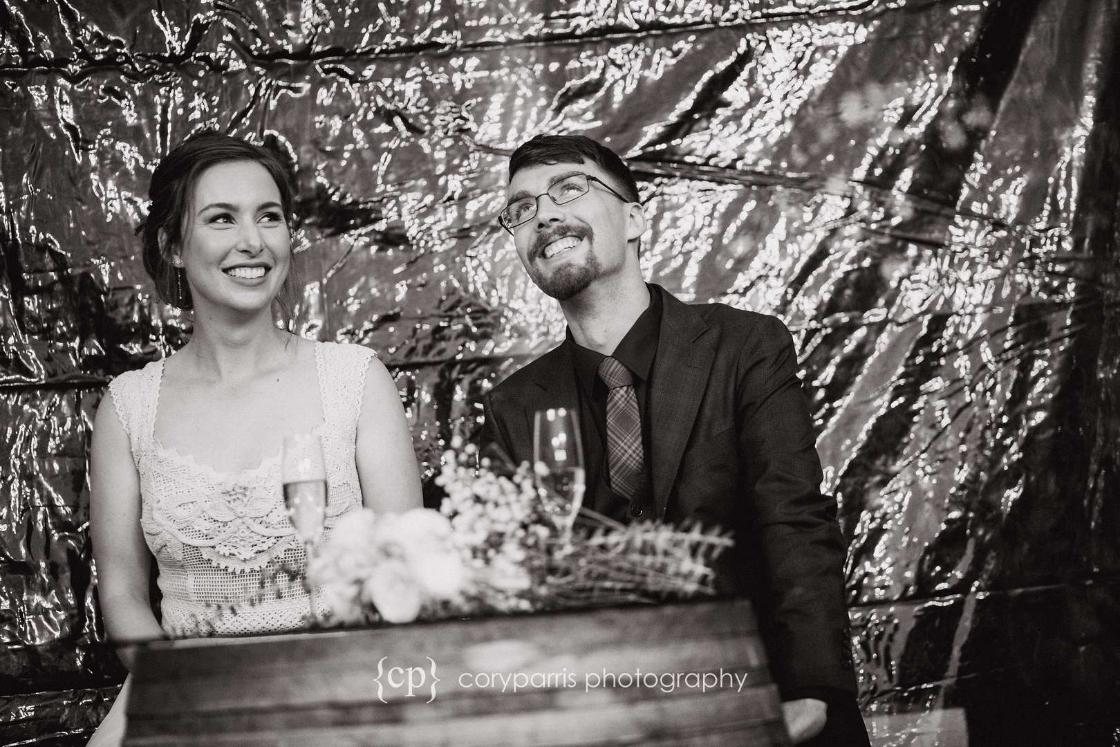 Bride and groom during toasts at DeLille Cellars Chateau in Woodinville