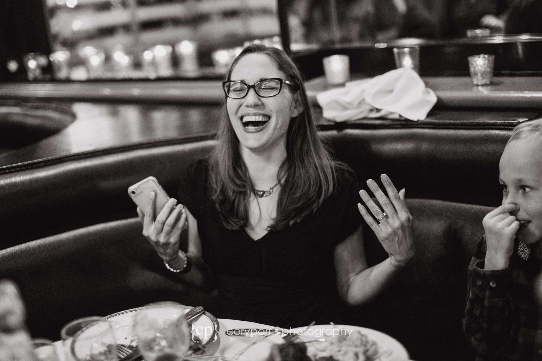 Wedding guest laughing Seattle wedding photojournalism