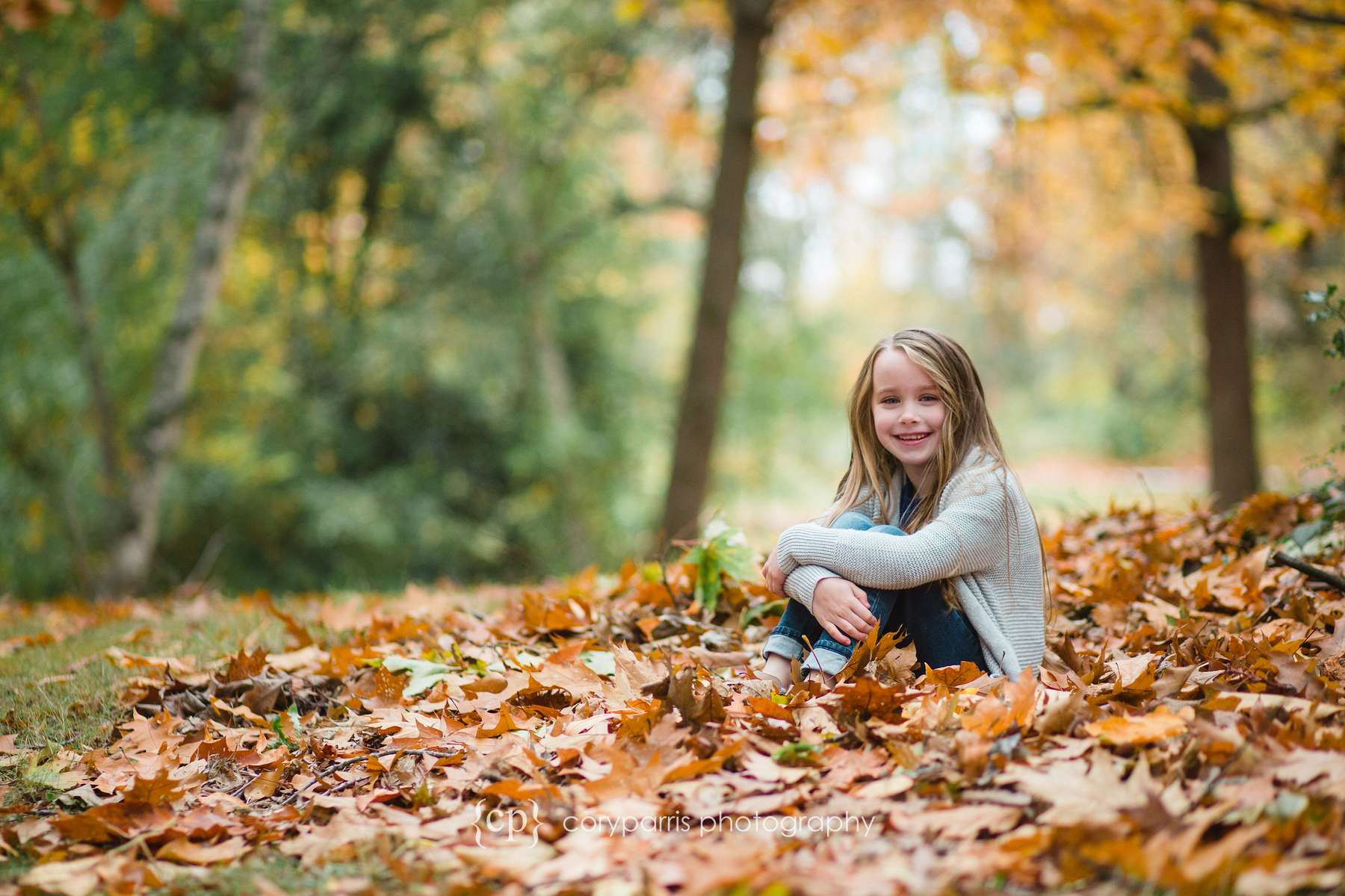 Girl in fall leaves Seattle portrait photographer