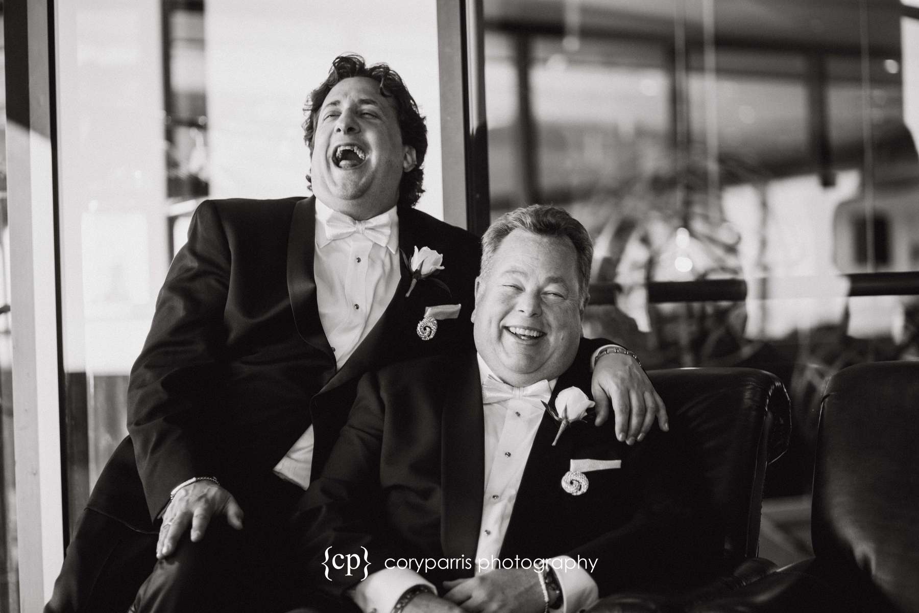 Two grooms laughing together
