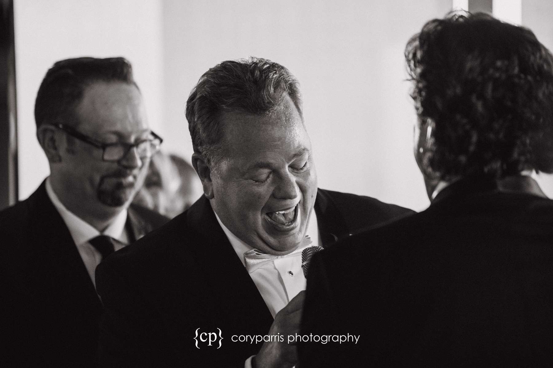 Groom laughing during Columbia Tower Club ceremony