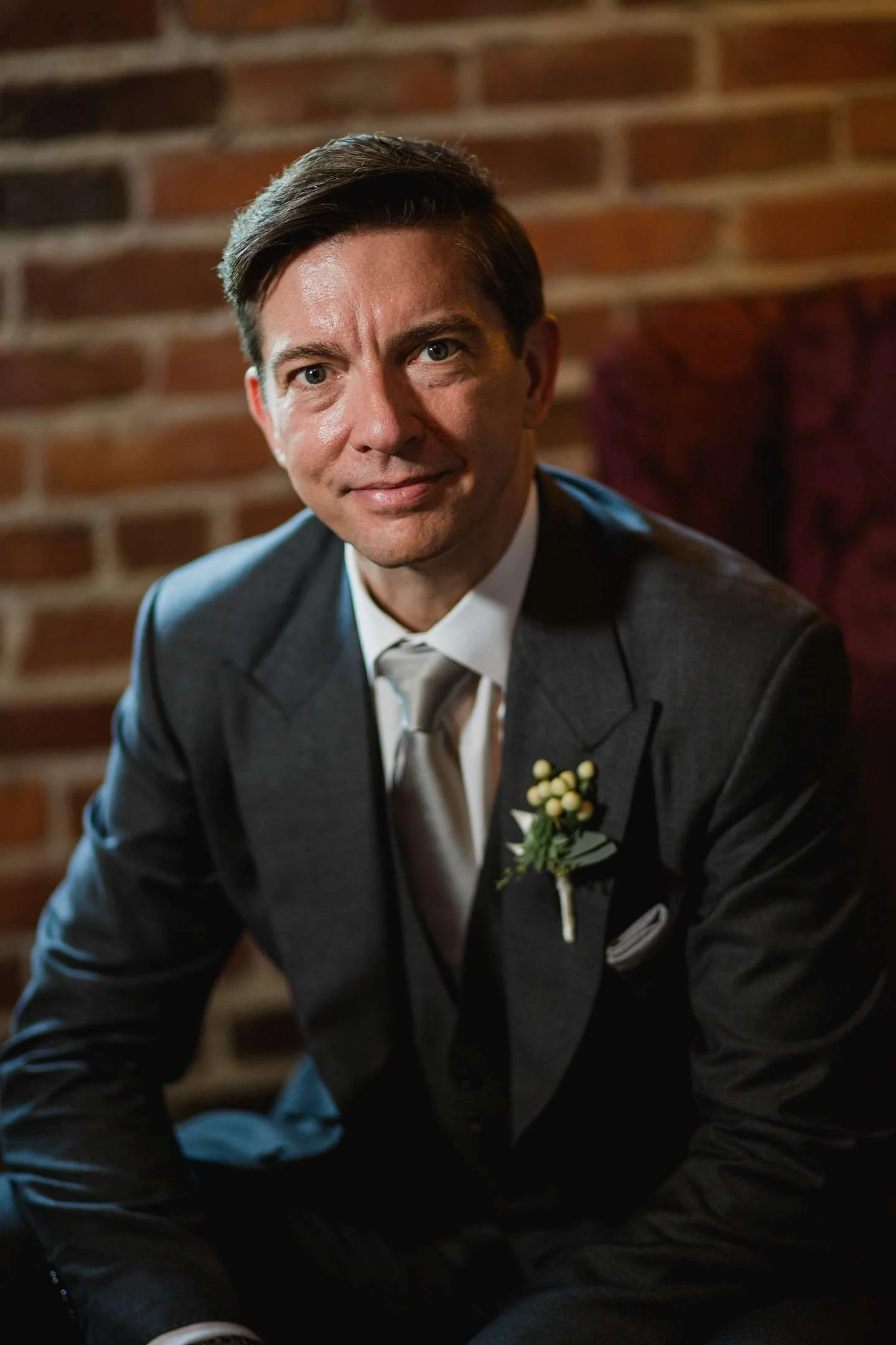 Groom portrait with brick wall Seattle wedding photography