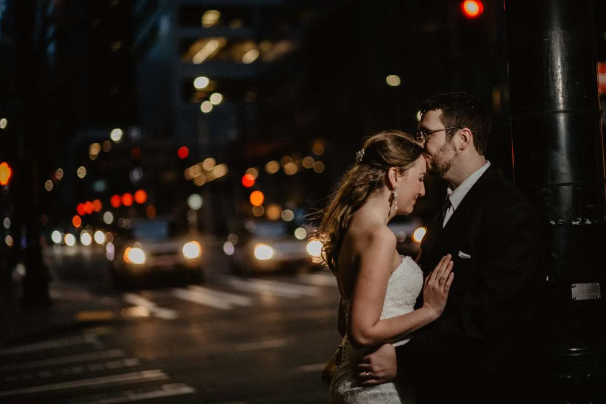 Portrait of Emily and David at night on the streets of Seattle after their Seattle Courthouse wedding. I love combining flash and the city lights. 