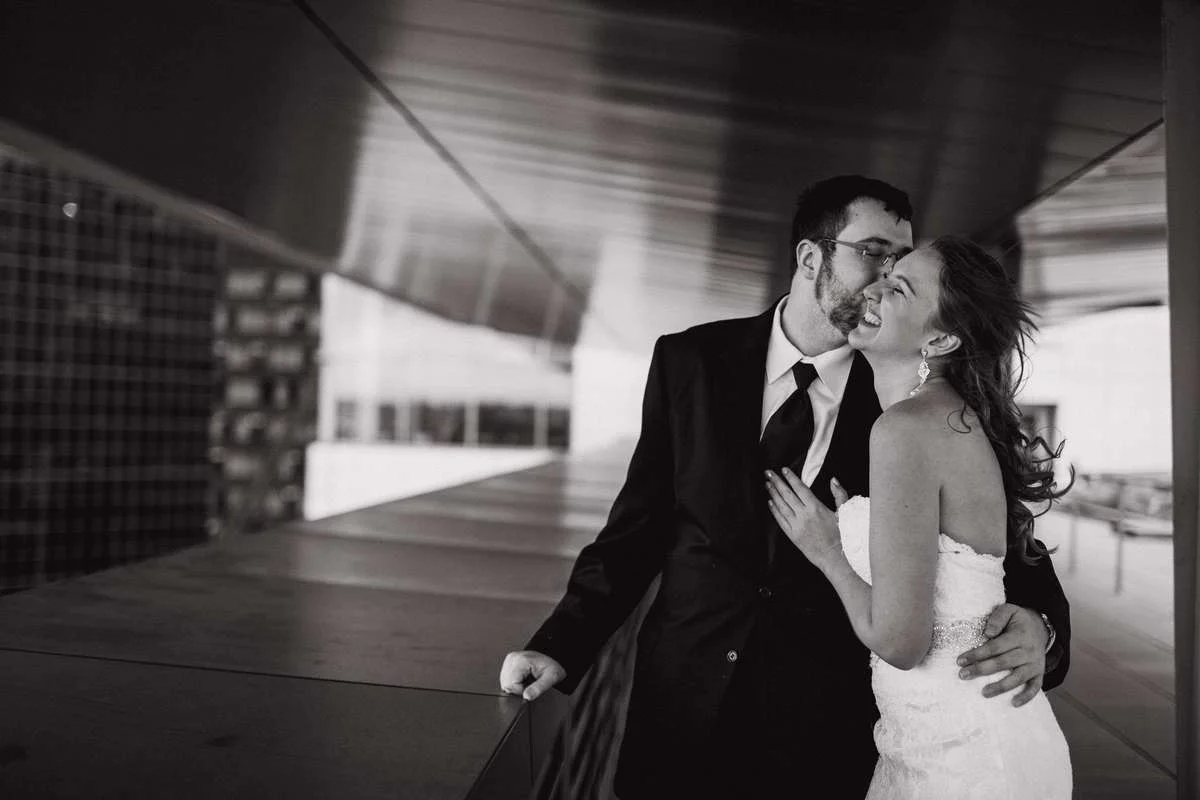Emily and David laughing on the rooftop of the Seattle Municipal Court just before their wedding.