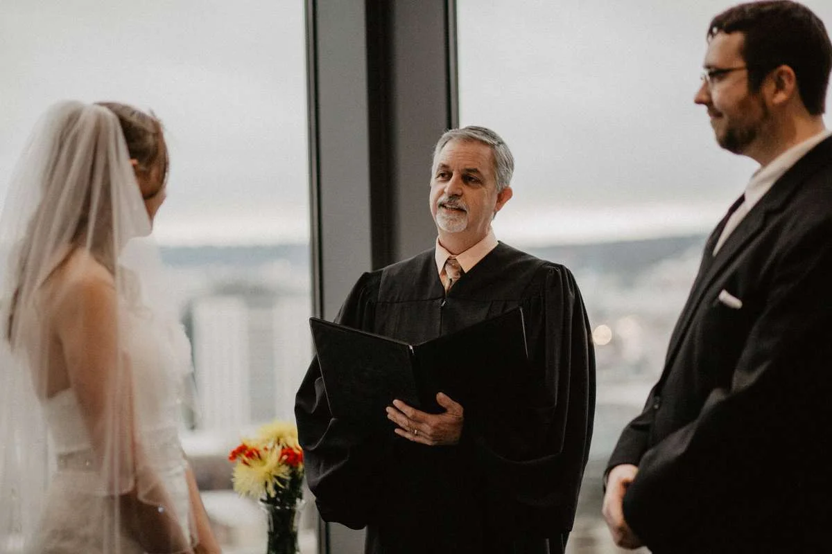 Seattle Judge McKenna marrying Emily and David.