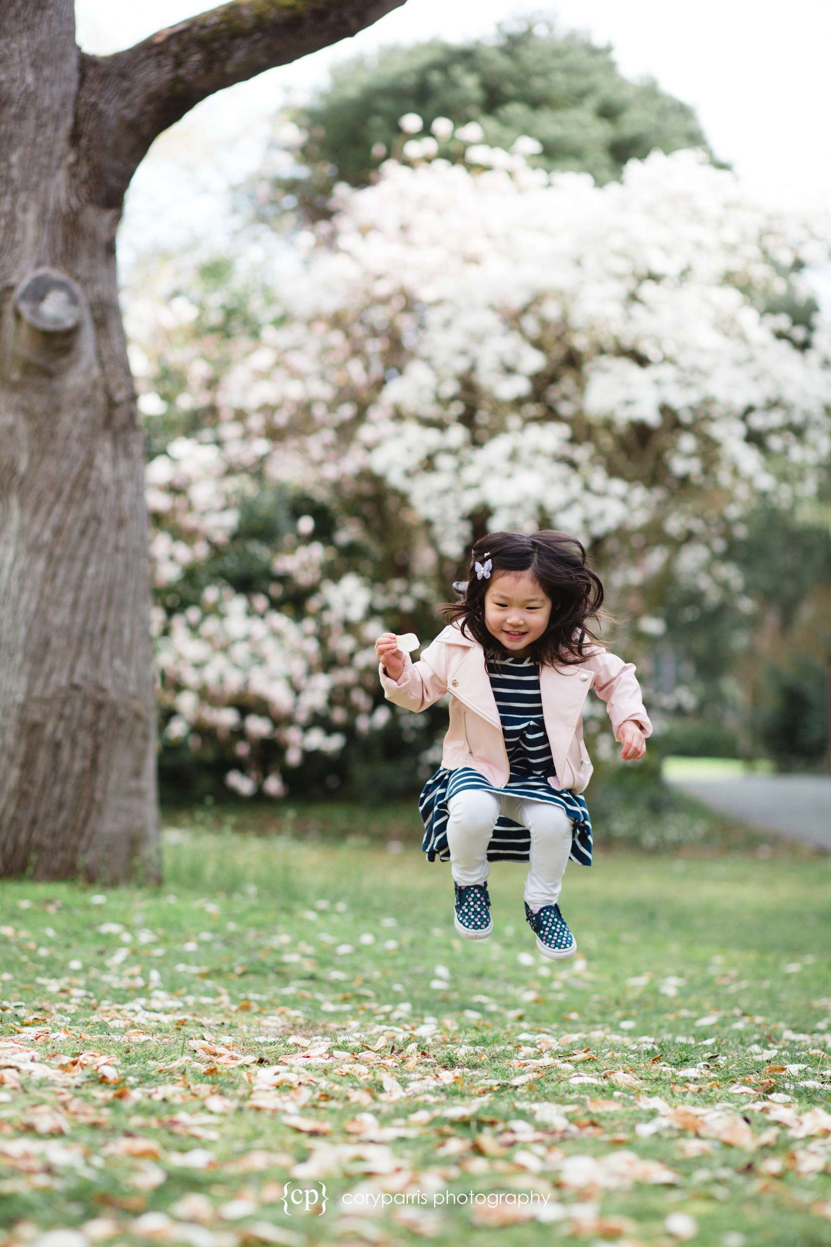 Jumping little girl portrait