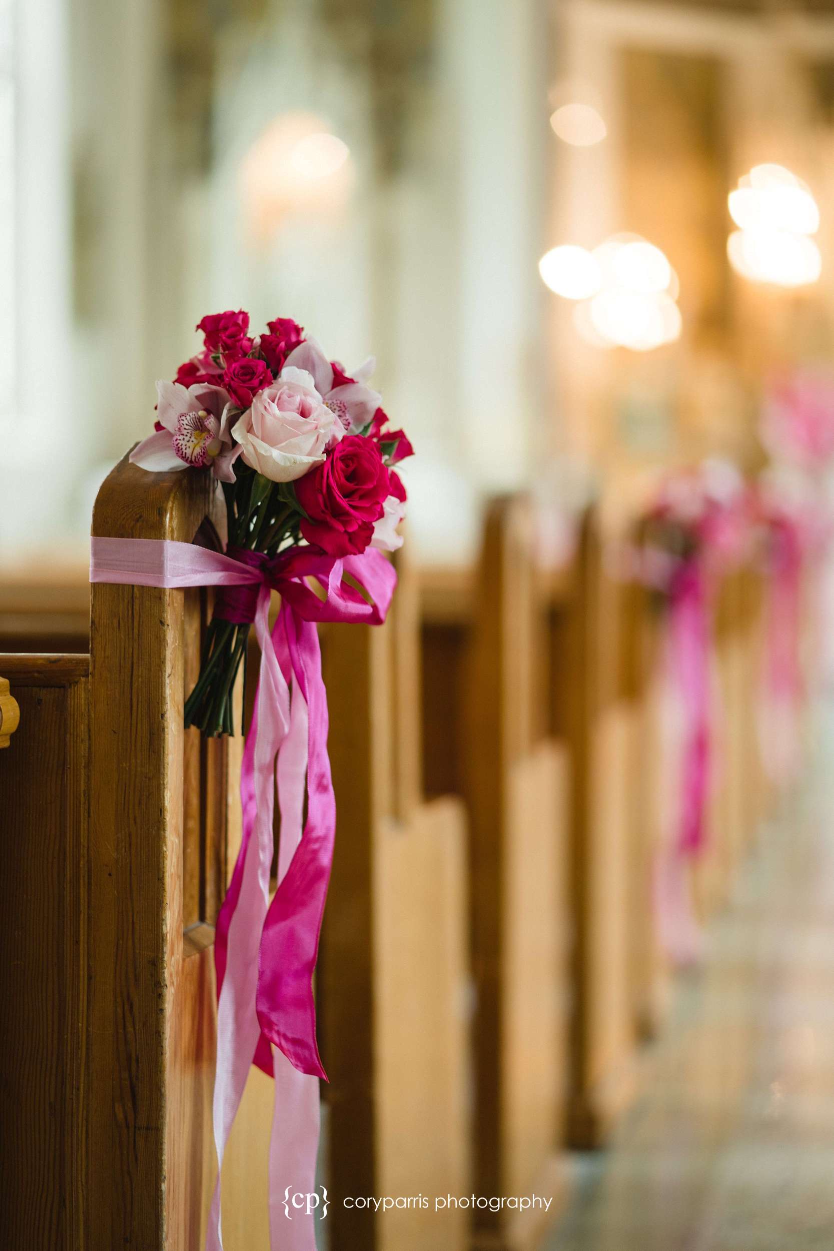 pink flowers on pews seattle wedding