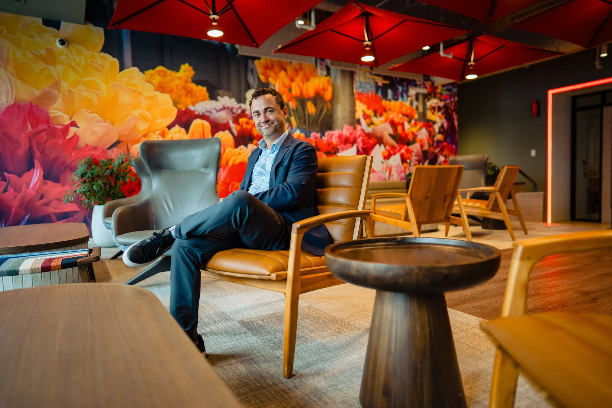 A Fintech CEO sitting in the very cool office space
