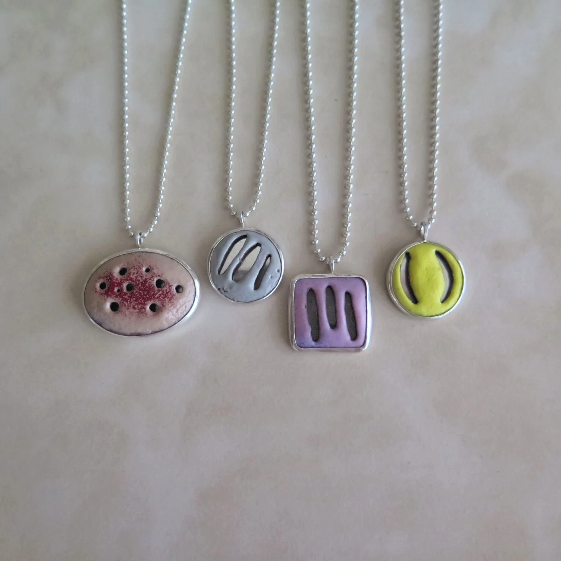 Enamel Slashed and Pierced Necklaces