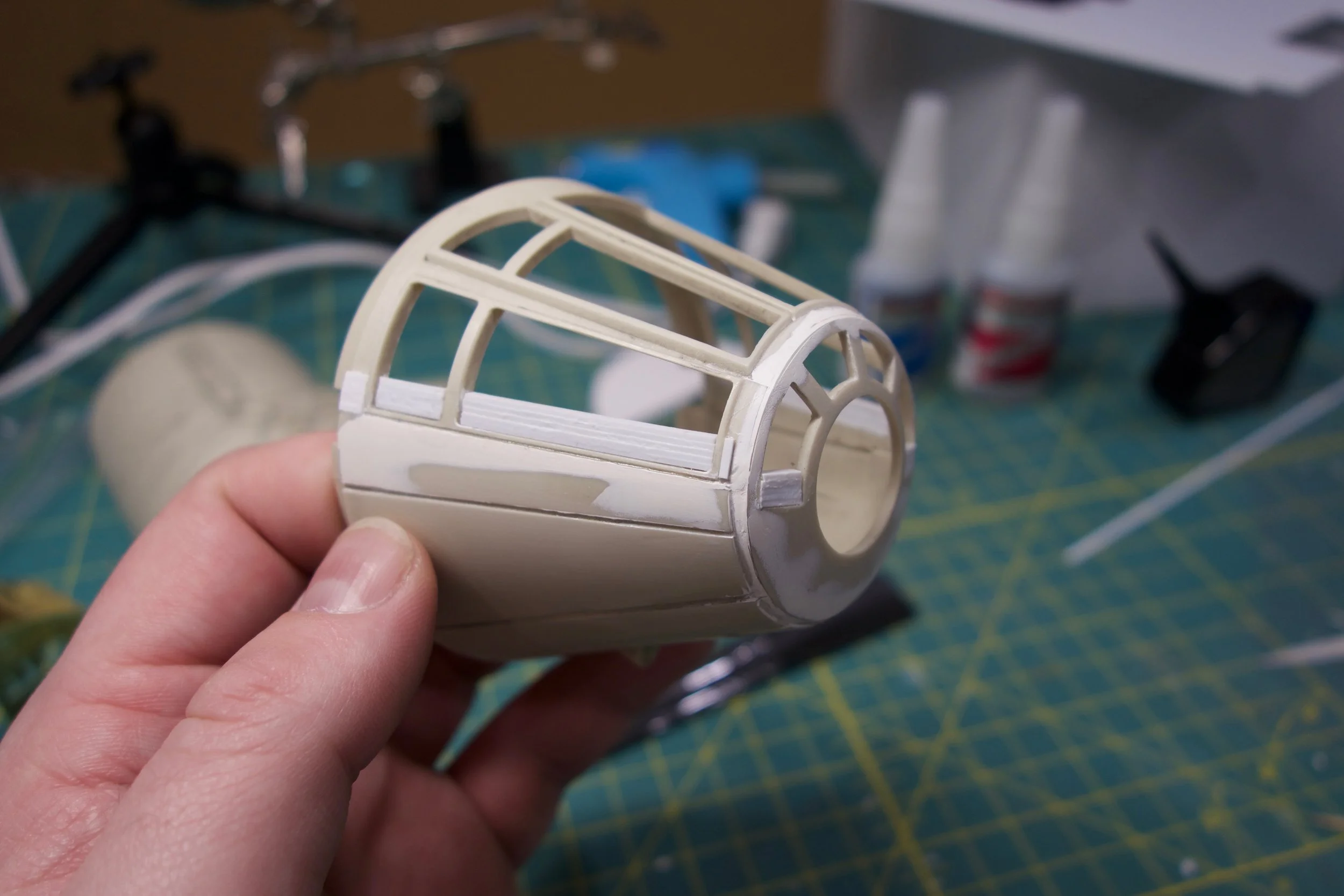 Additional styrene strips were needed before and after the windows on the sides to shift the panels and panel lines appropriately. I found the bottom of the base window mold was pretty close to where that panel line should go, so I just left that as a foundation for scribing the panel line later.
