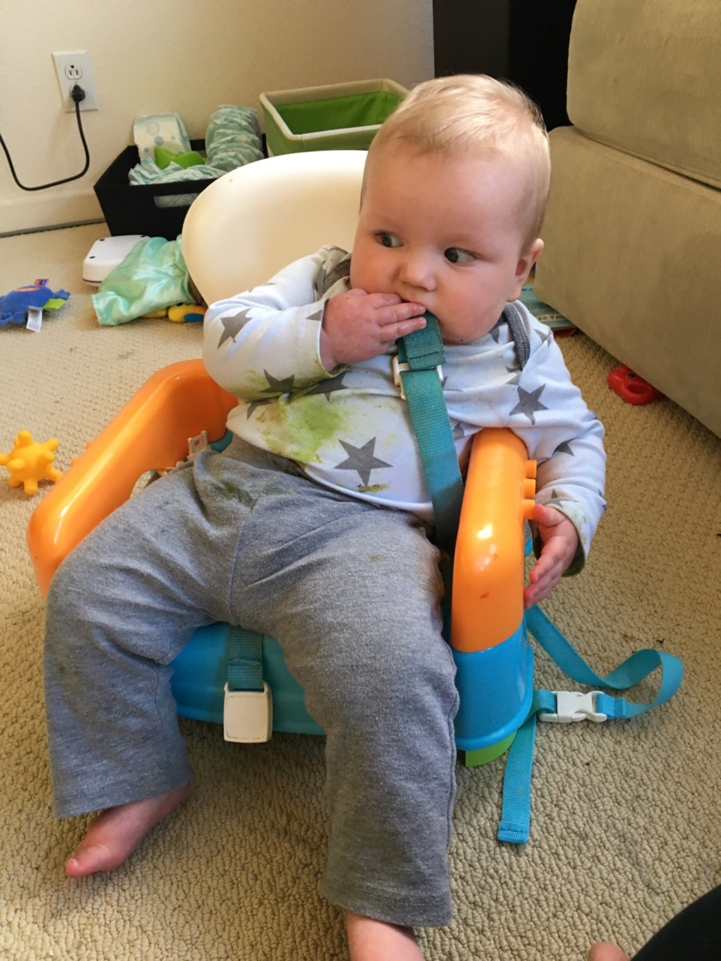 Lounging in his high chair