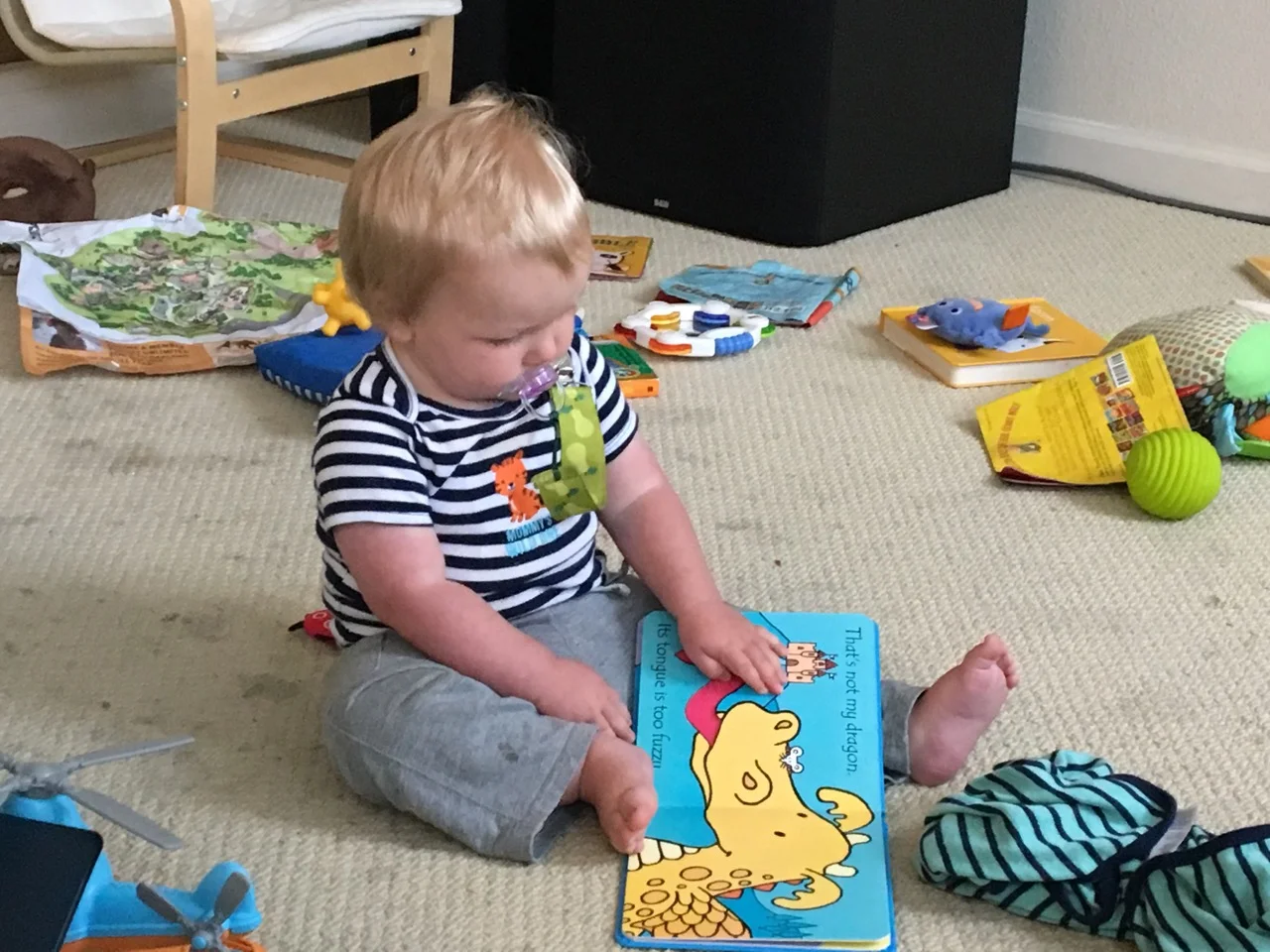 "Reading" his That's Not My Dragon book