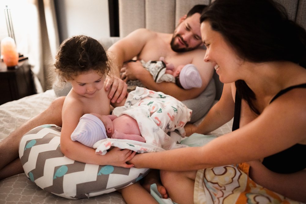 big sister meets baby after home birth 