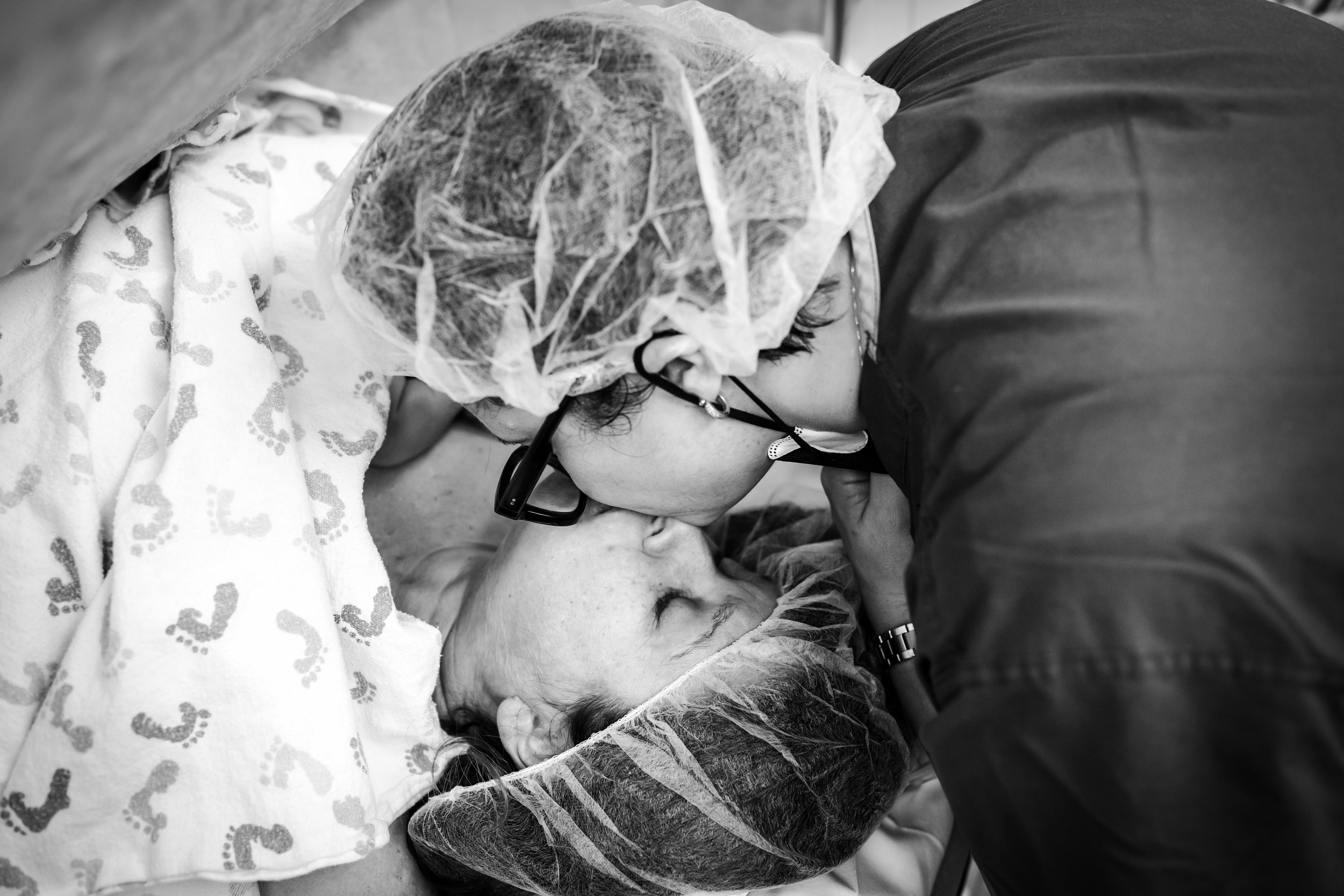 couple kiss during cesarean birth at Fort Worth hospital