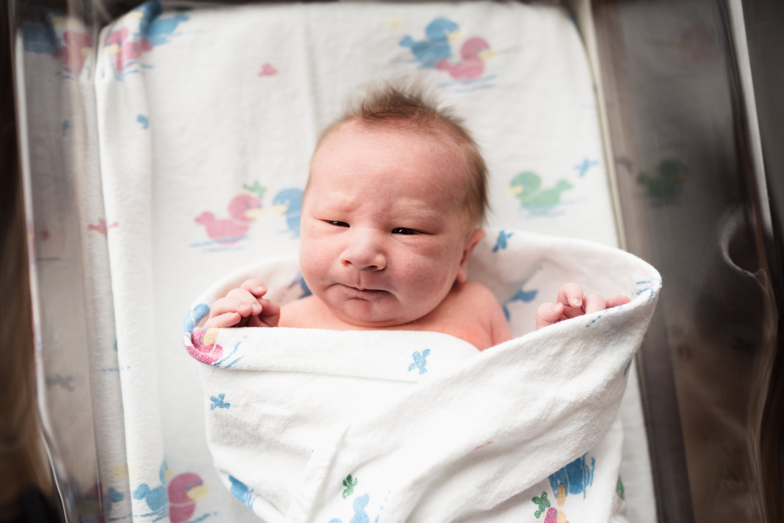 close up of newborn wrapped in hospital swaddle | Kathryn J birth Stories | Fresh 48 guide | Dallas birth photographer