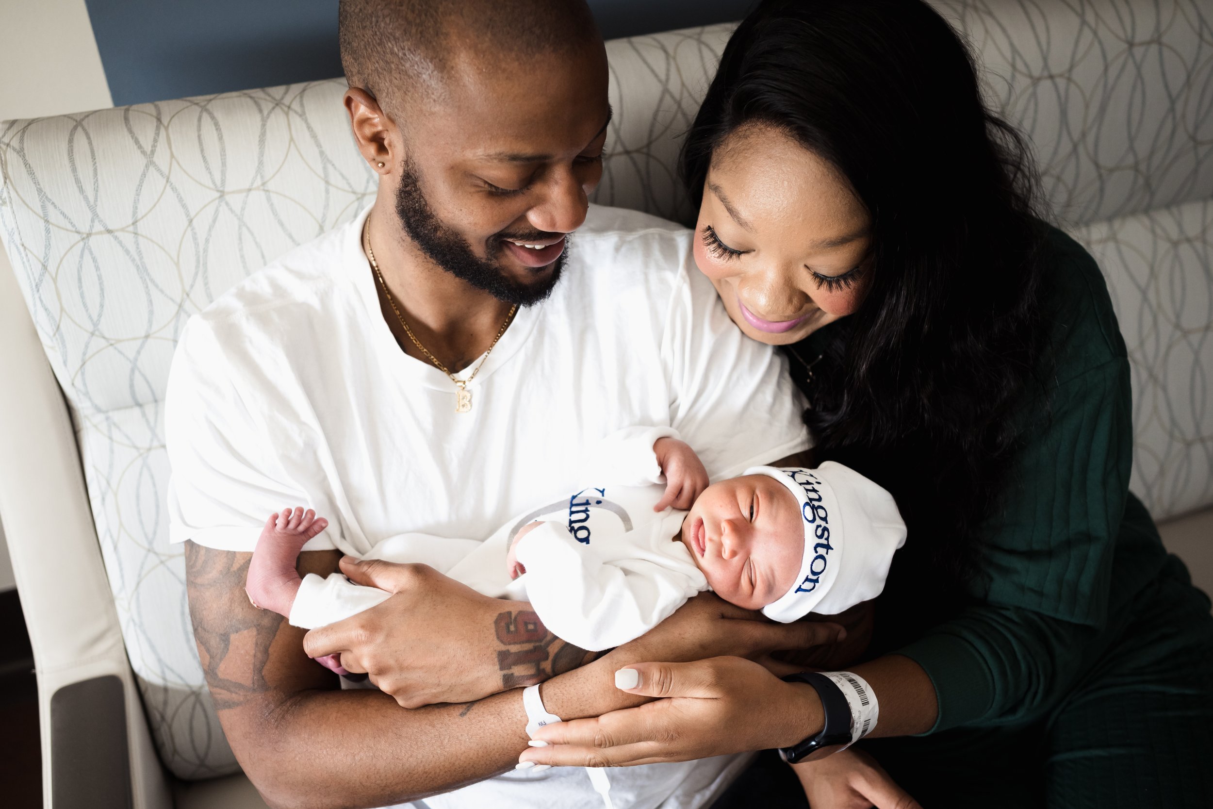 couple looks at newborn together after birth | Kathryn J birth Stories | Fresh 48 guide | Dallas birth photographer