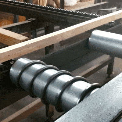 The short pieces have glue applied to the ends and are shot into each other at high speeds to form long sticks like you see above. For thicker moulding, several of these sicks will be glued together.