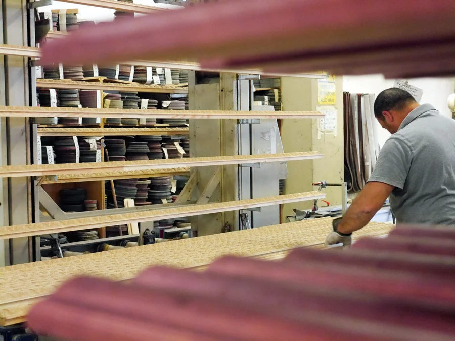 This is as close to "mass production" as these facilities get! The artisans creating the hand-finishes for the mouldings we buy for Artists Frame Service are undoubtably the best.