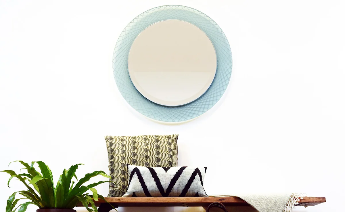 This Prisma Spiro mirror showcases a unique radiating circular design in sea glass acrylic with platinum accent color. Imagine the possibilities - we can design any size mirror from any of our thousands of frame mouldings .