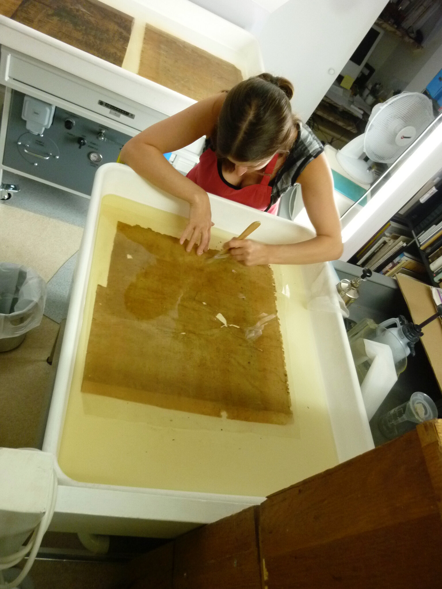 15_g Removing the old starch paste from the verso of each sheet. Paper could _breath_ and dislodge discolouration.jpg