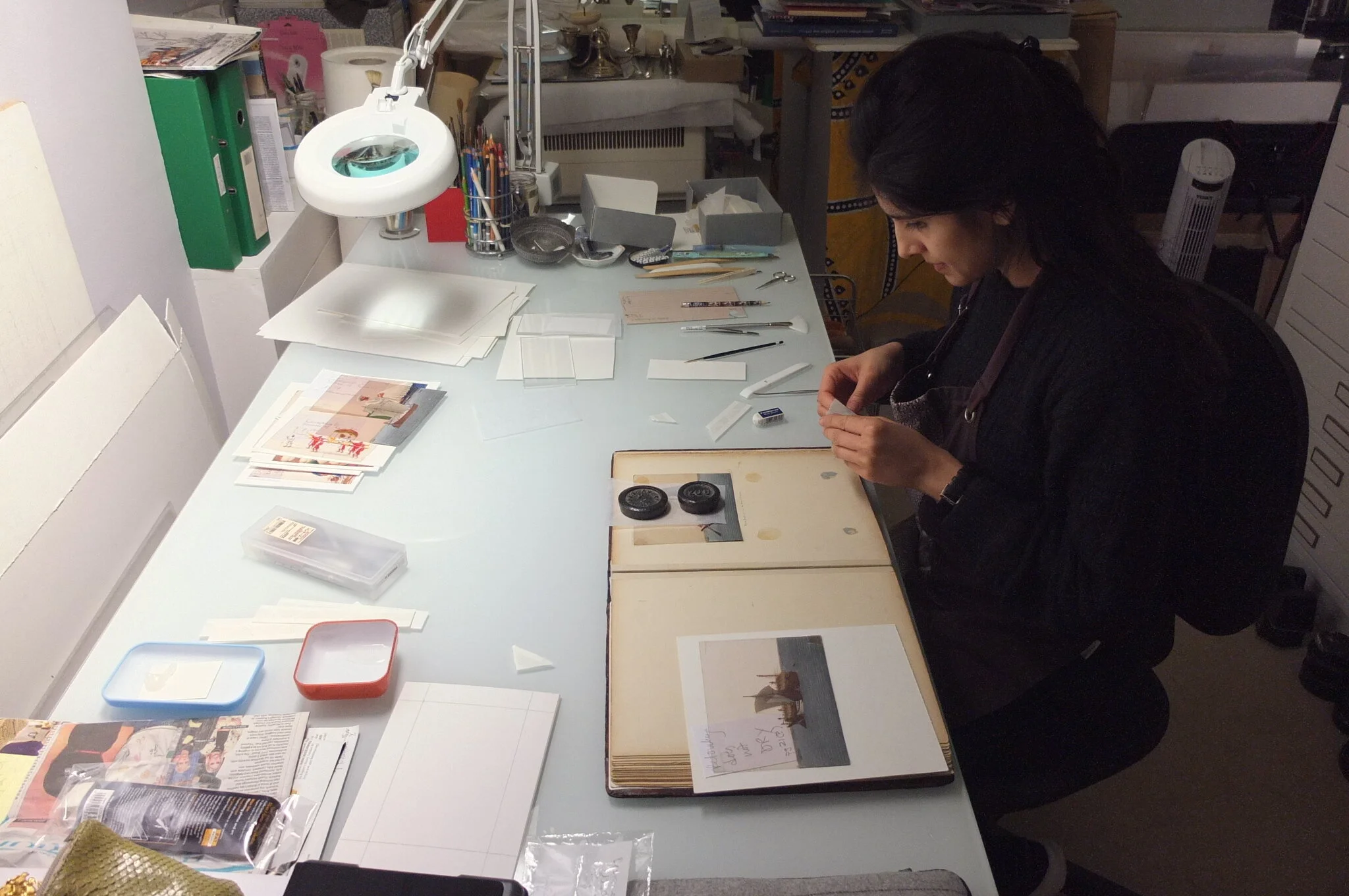 e_Using photo corners to mount Mica into album.jpg