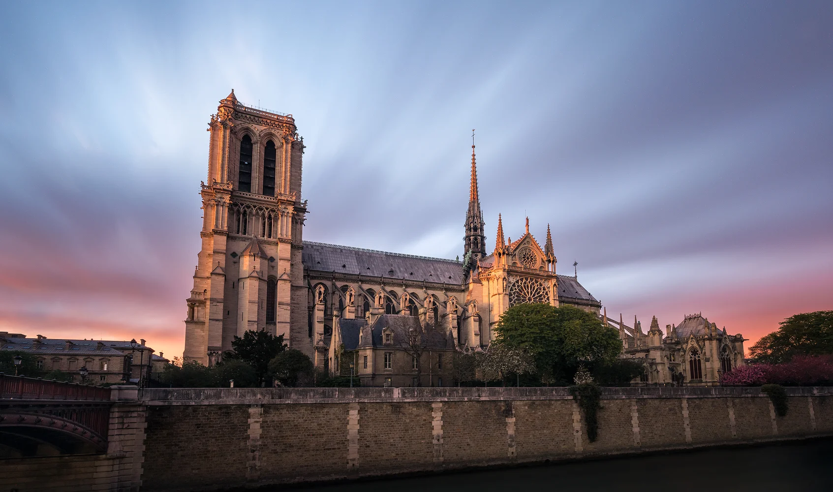 Along the Eiffel Tower, the subject of my previous upload, another important landmark of the French capital is the almost 700-year-old Cathédrale Notre-Dame de Paris. This mid-April evening the setting sun was side-lighting the church as well as painting the horizon with magnificent colors. I decided to go to the other side of the river Seine to take a picture of the cathedral as I find it more appealing from the side than from the front entrance. As for the photo geek stuff, this is a long-exposure image of about seven and a half minutes, edited using Lightroom, Color Efex Pro 4 and Photoshop.