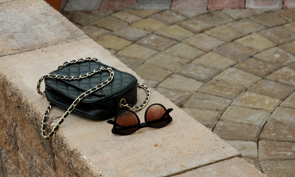 quilted bag and sunglasses