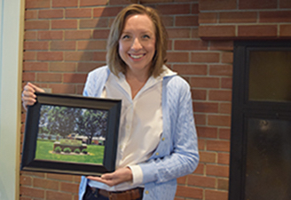 Rev. Shanna Steitz, senior minister of Community Christian Church of Kansas City (a Bethany Fellows alum and fellow) holds a photo of Red Bridge Christian Church. 