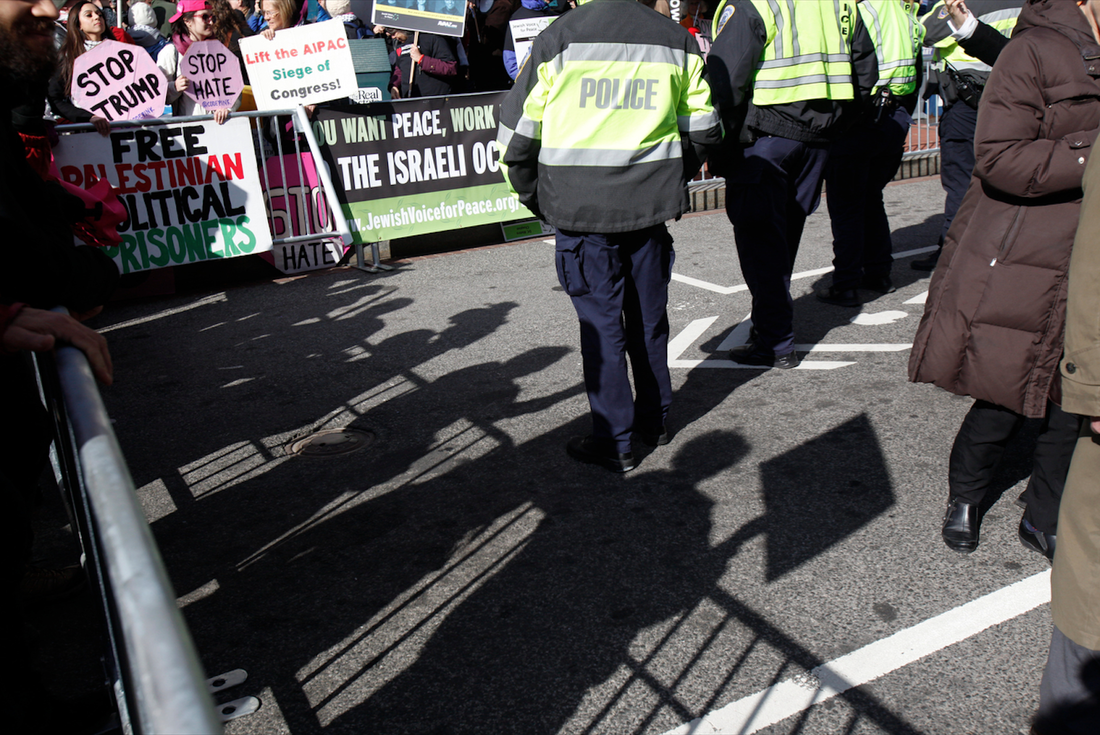  Protesters cast shadows outside the Walter E Washington Convention Center, where AIPAC holds its annual conference. 