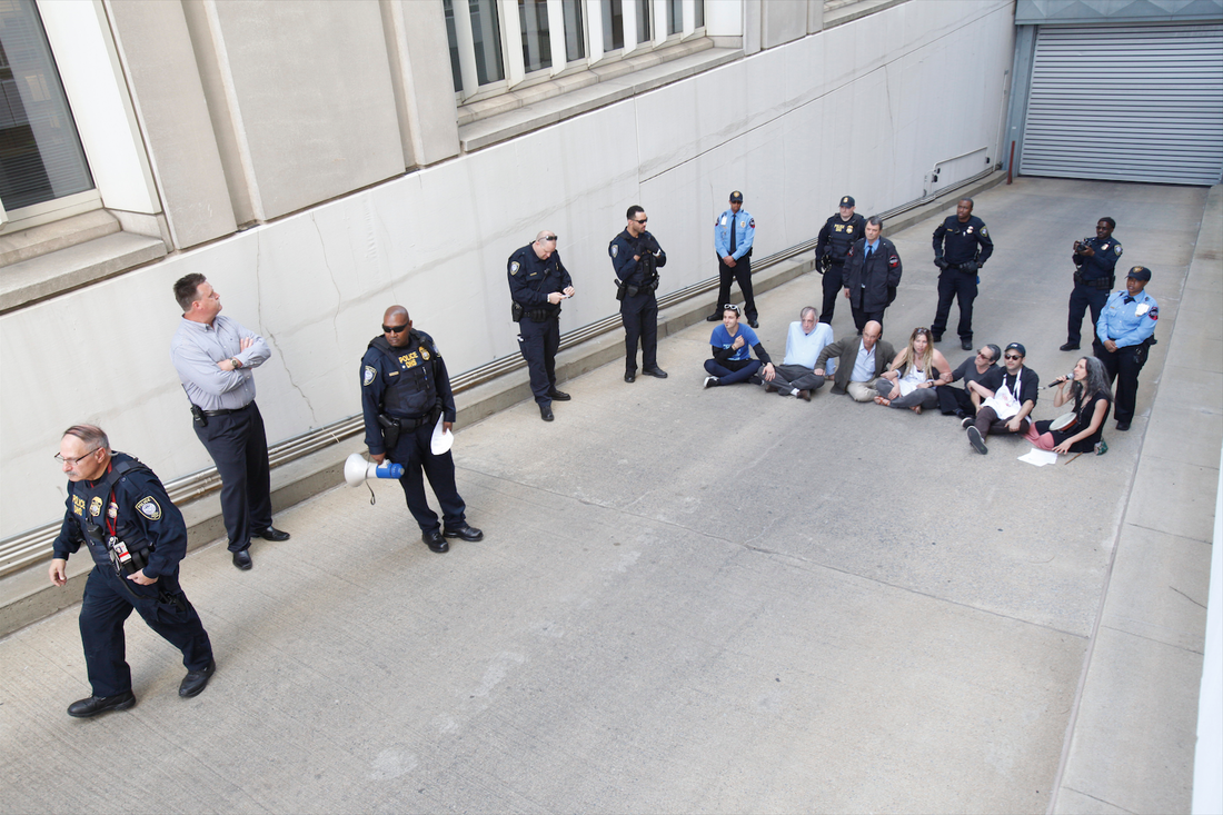  Demonstrators block a federal office garage entrance in Washington DC. 