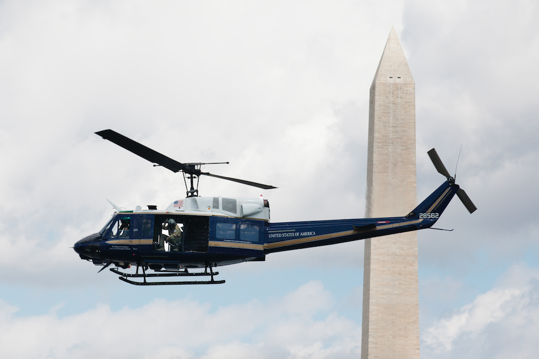  A specially painted UH-1N Huey Helicopter flown by the US Air Force passes the Washington Monument. 