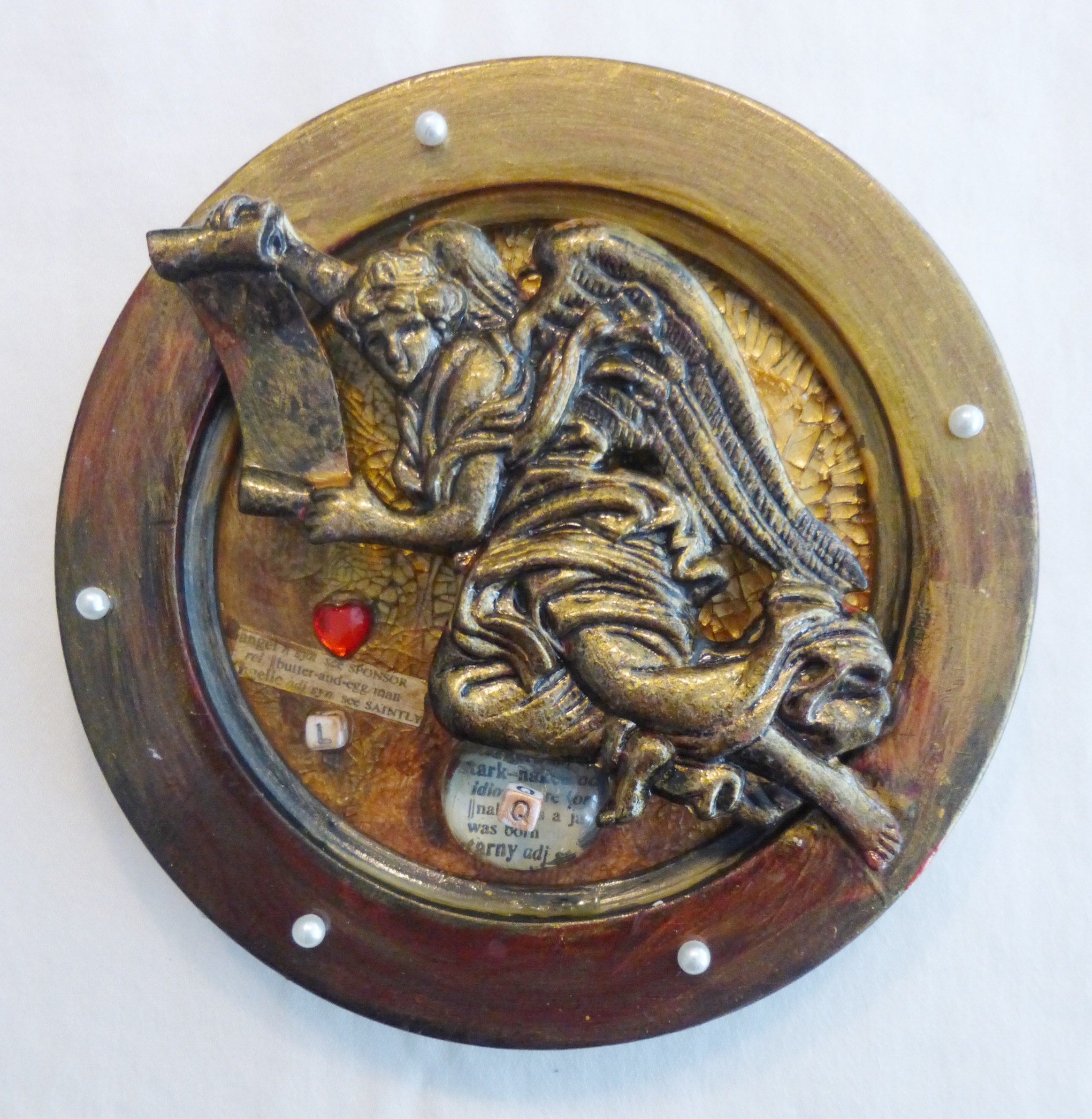 "911" - mixed media collage, round frame, angel ornament, acrylic paint, beads, text. The world ends tomorrow at twenty past seven, I'm putting the moon in a box, the stairway to heaven is crowded with angels trying to rescue the clocks.