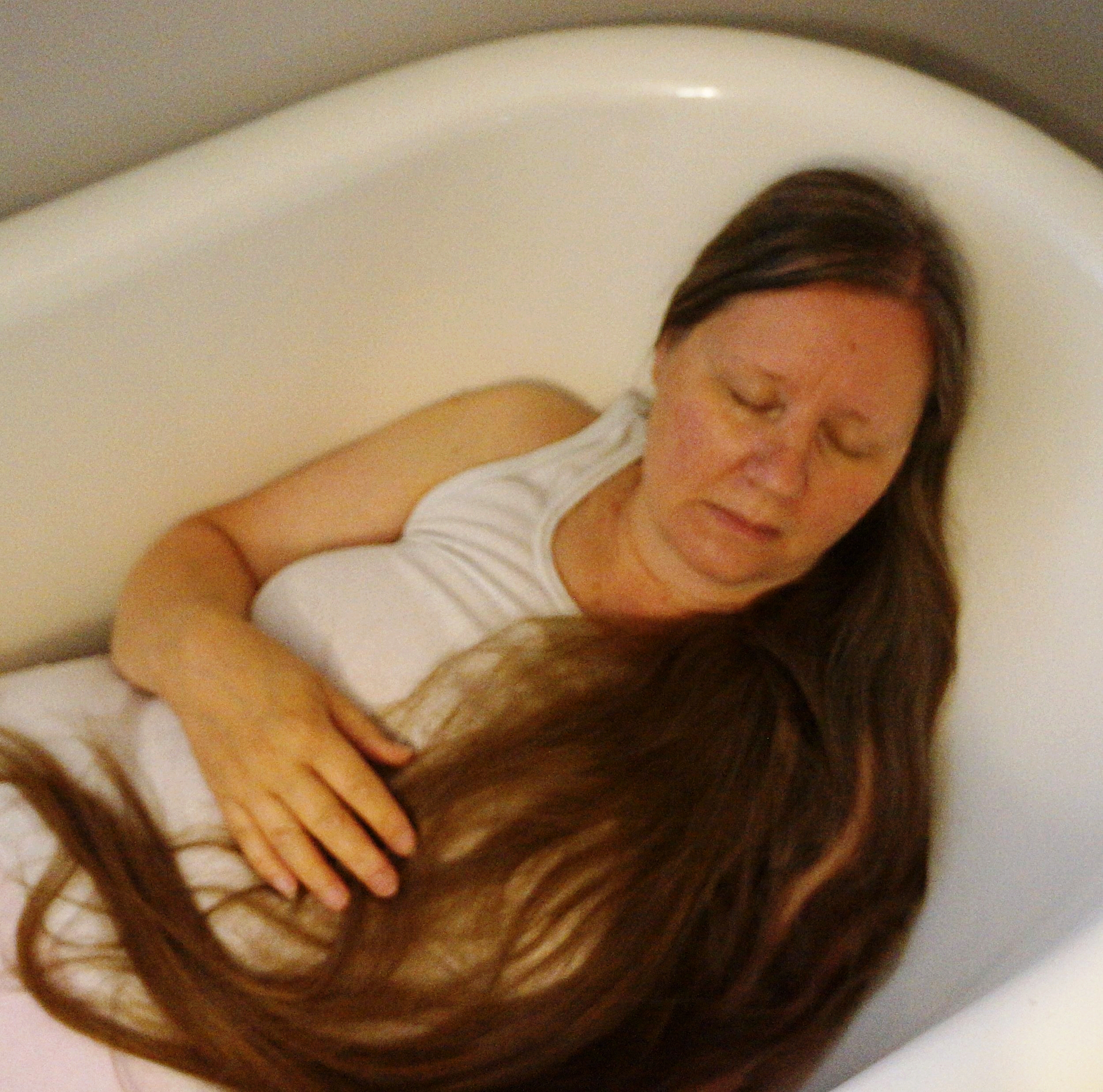 Original photograph. Set the camera, get in the bathtub, pose, get out of the bathtub, set camera, get back into the bathtub...repeat 30 times. Do it again the next day with water in the tub. Discard all of those ones. 