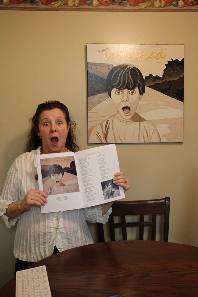 Brenda with the book and her painting..jpg