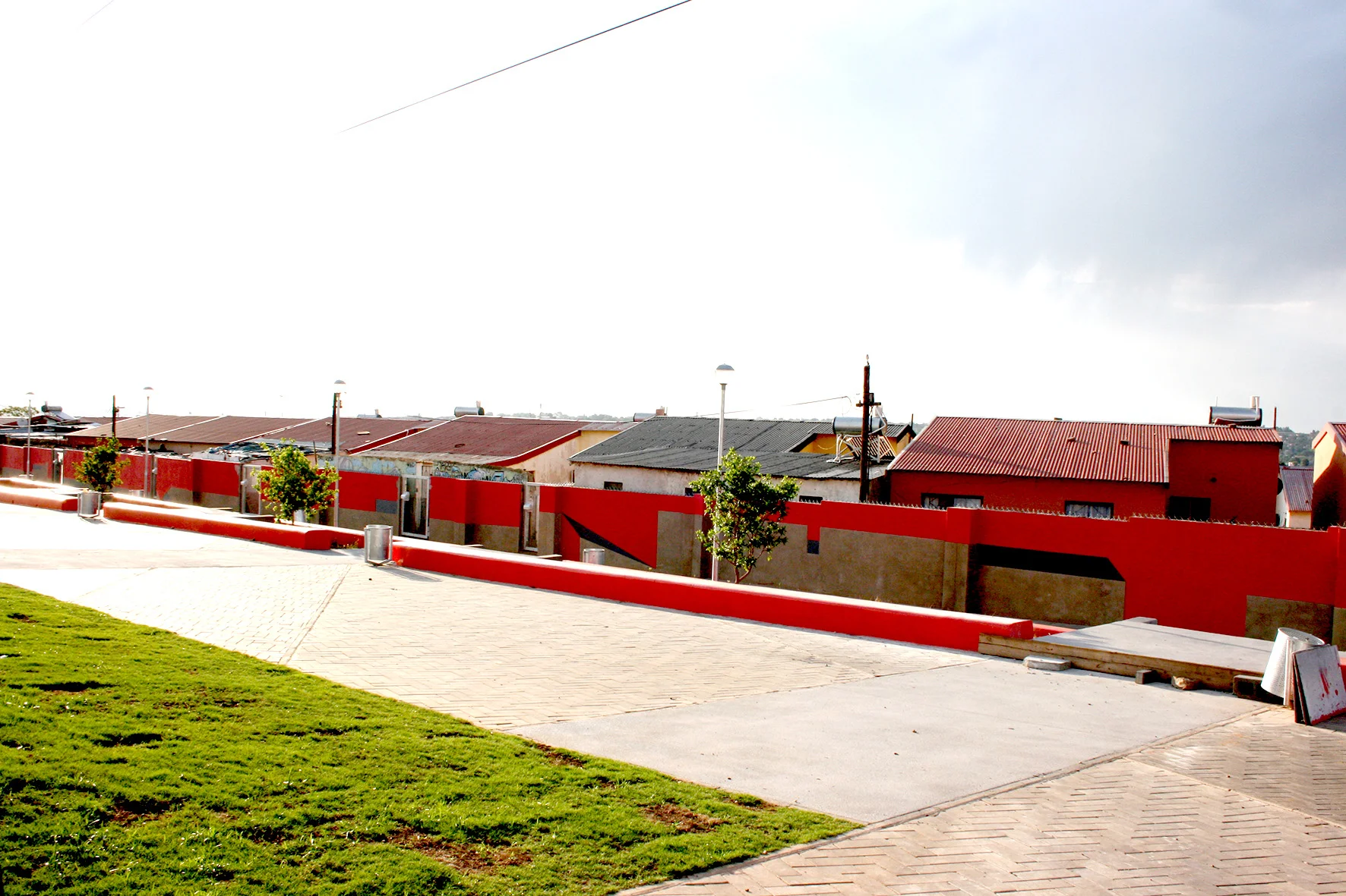 Boundary wall mural as edge to community