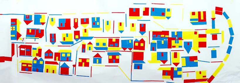 Urban route : The 'city' drawing reflects the experience which the students had of the neighbourhood, when drawing the buildings.