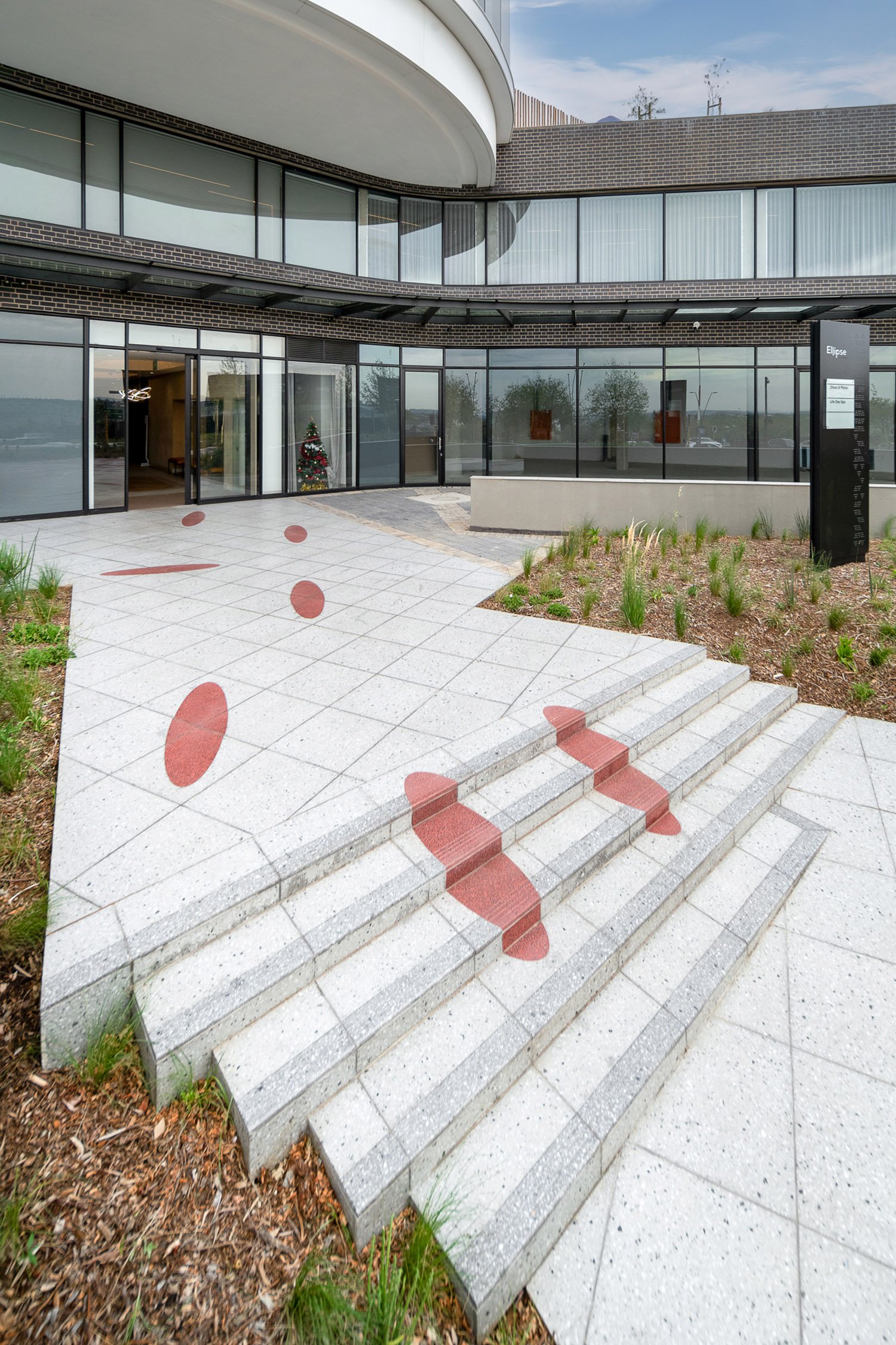 Tiles ‘climb’ the stairs toward the entrance of the building.