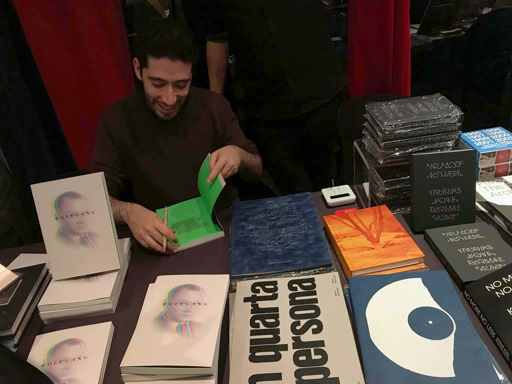 David Fathi signing copies of WOLFGANG at Polycopies
