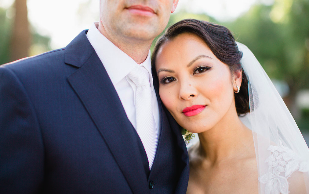 Asian Bridal Makeup with Eyeliner and Red Lipstick featuring an updo with veil. Wedding Hair and Makeup by Vanity Belle in Orange County (Costa Mesa) and San Diego (La Jolla)
