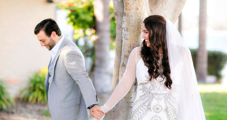 Wedding Photography with Couple Smiling Holding Hands Outdoors. Bridal Hair and Makeup by Vanity Belle in Orange County (Costa Mesa) and San Diego (La Jolla)