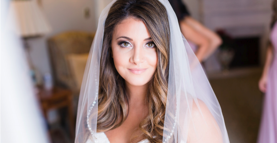 Brunette Bride with Curled Hair Down and Veil. Wedding Day hairstyles and Makeup by Vanity Belle in Orange County (Costa Mesa) and San Diego (La Jolla)