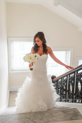 Wedding Photos with Bride Walking Up Stairs with Bouquet. Bridal Hair and Makeup by Vanity Belle in Orange County (Costa Mesa) and San Diego (La Jolla)