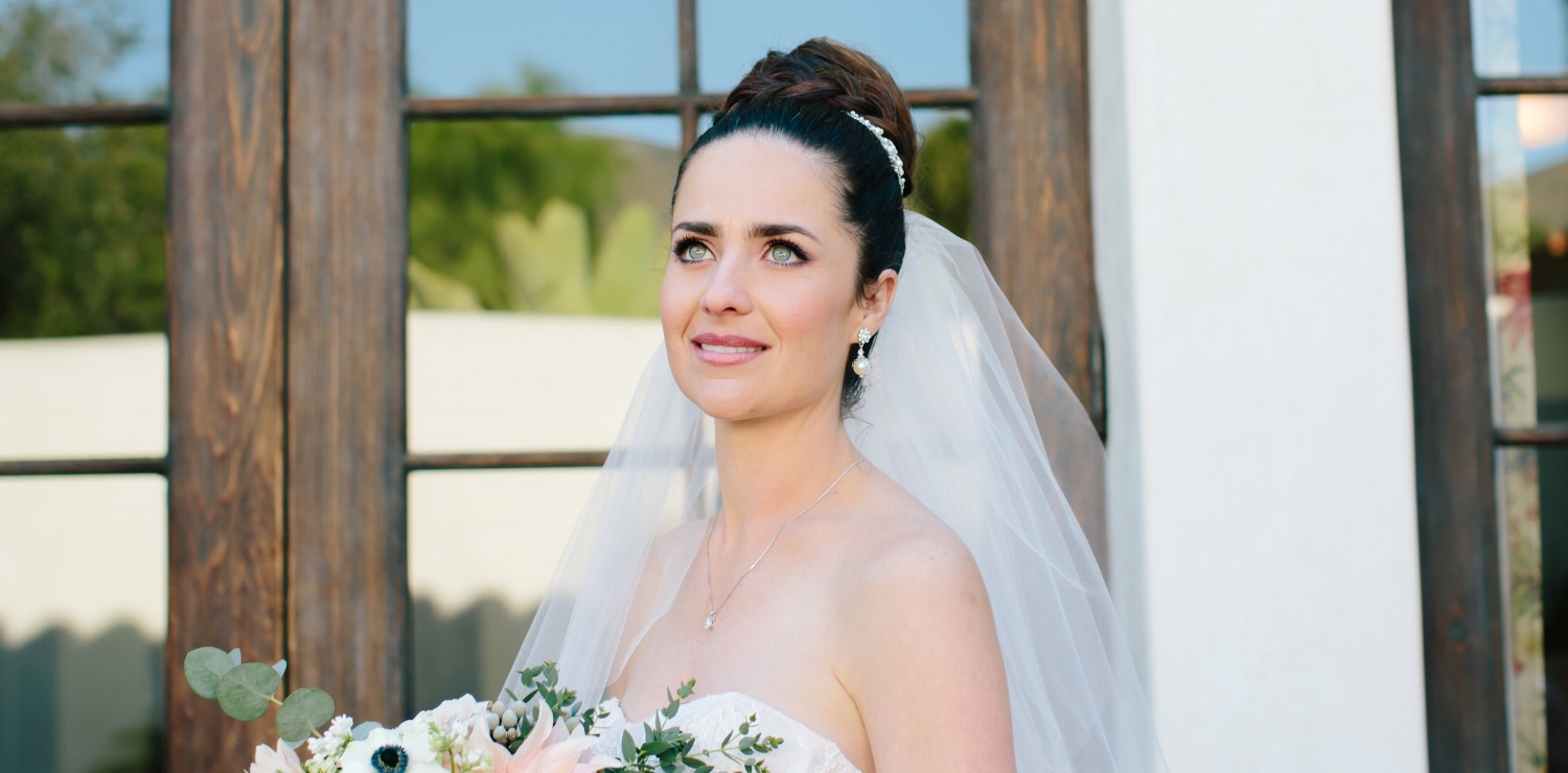 Brunette Bride with Braid Updo and Veil + Makeup for Blue Eyes. Bridal beauty by Vanity Belle in Orange County (Costa Mesa) and San Diego (La Jolla) 