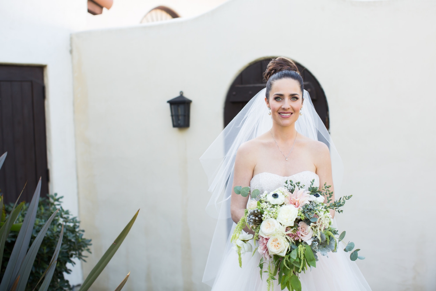 Brunette Bride with Braid Updo and Bouquet. Wedding Hair and Makeup by Vanity Belle in Orange County (Costa Mesa) and San Diego (La Jolla) 