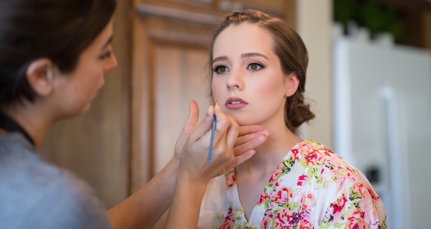 Young Brunette Bride with Natural Makeup in floral robe on Wedding Day. Bridal Hair and Beauty by Vanity Belle in Orange County (Costa Mesa) and San Diego (La Jolla)