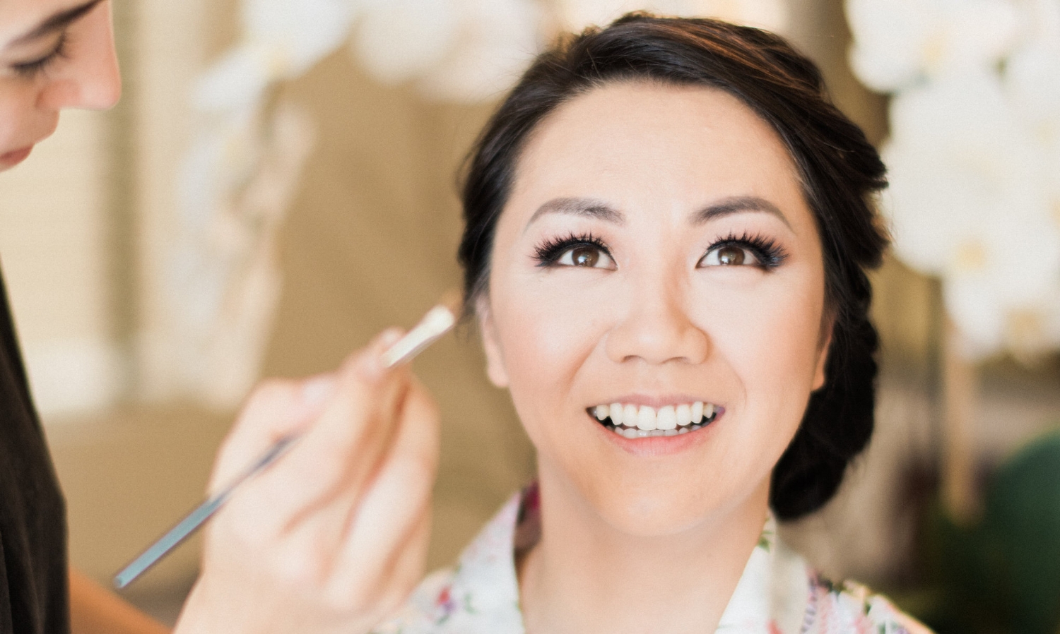 Asian Bride Morning of Wedding with Simple Makeup and Eyeliner in Floral Robe. Bridal Hair and Makeup by Vanity Belle in Orange County (Costa Mesa) and San Diego (La Jolla)